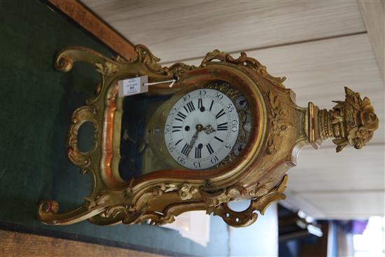 A mid 18th century German carved giltwood striking and chiming mantel clock, 26in.